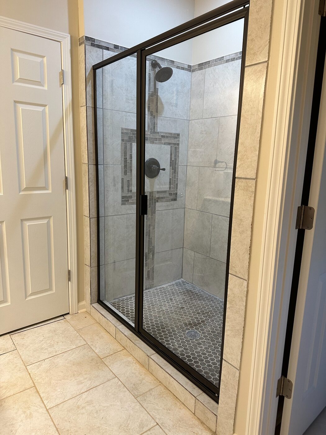 Black framed sliding shower enclosure