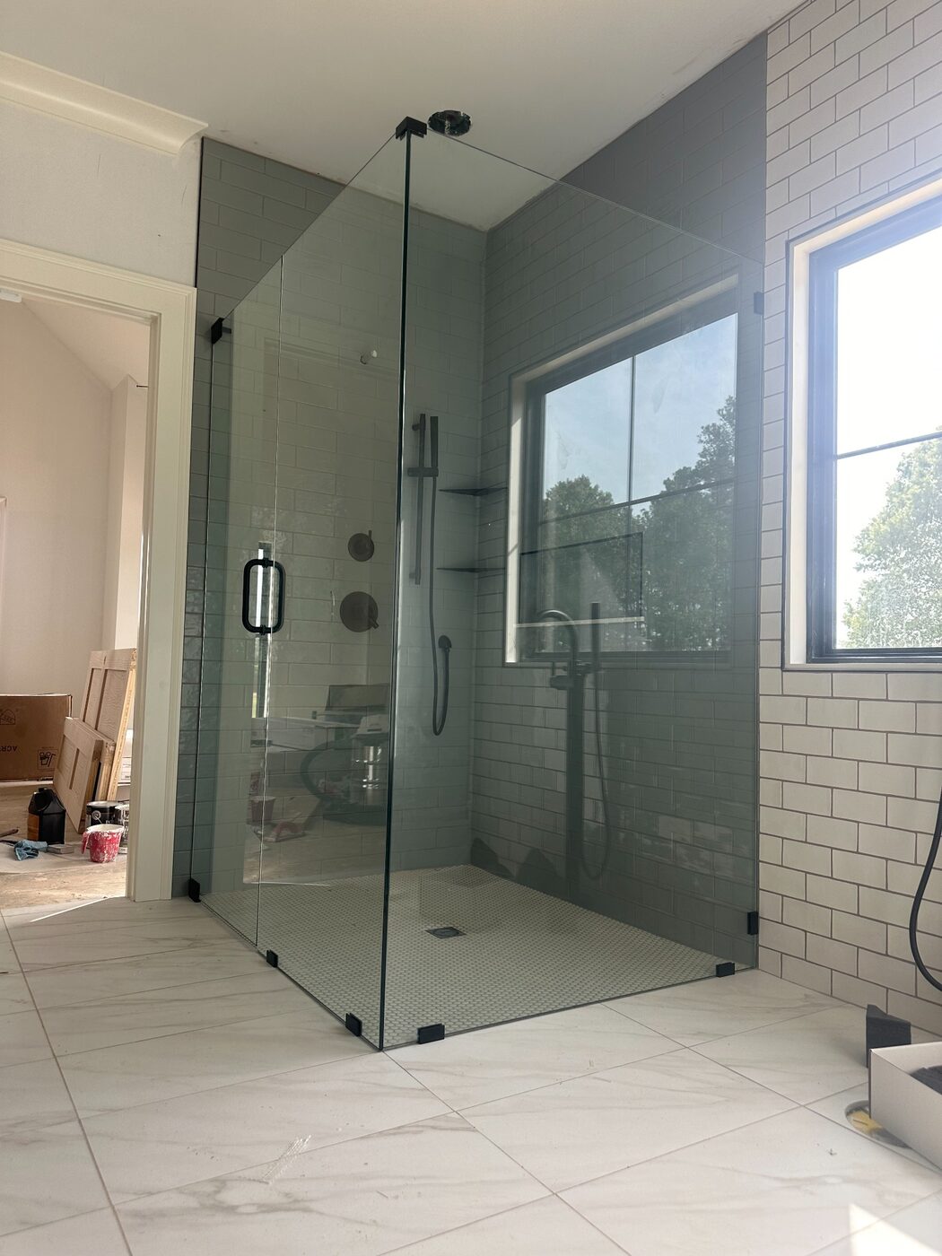 Large frameless corner shower enclosure